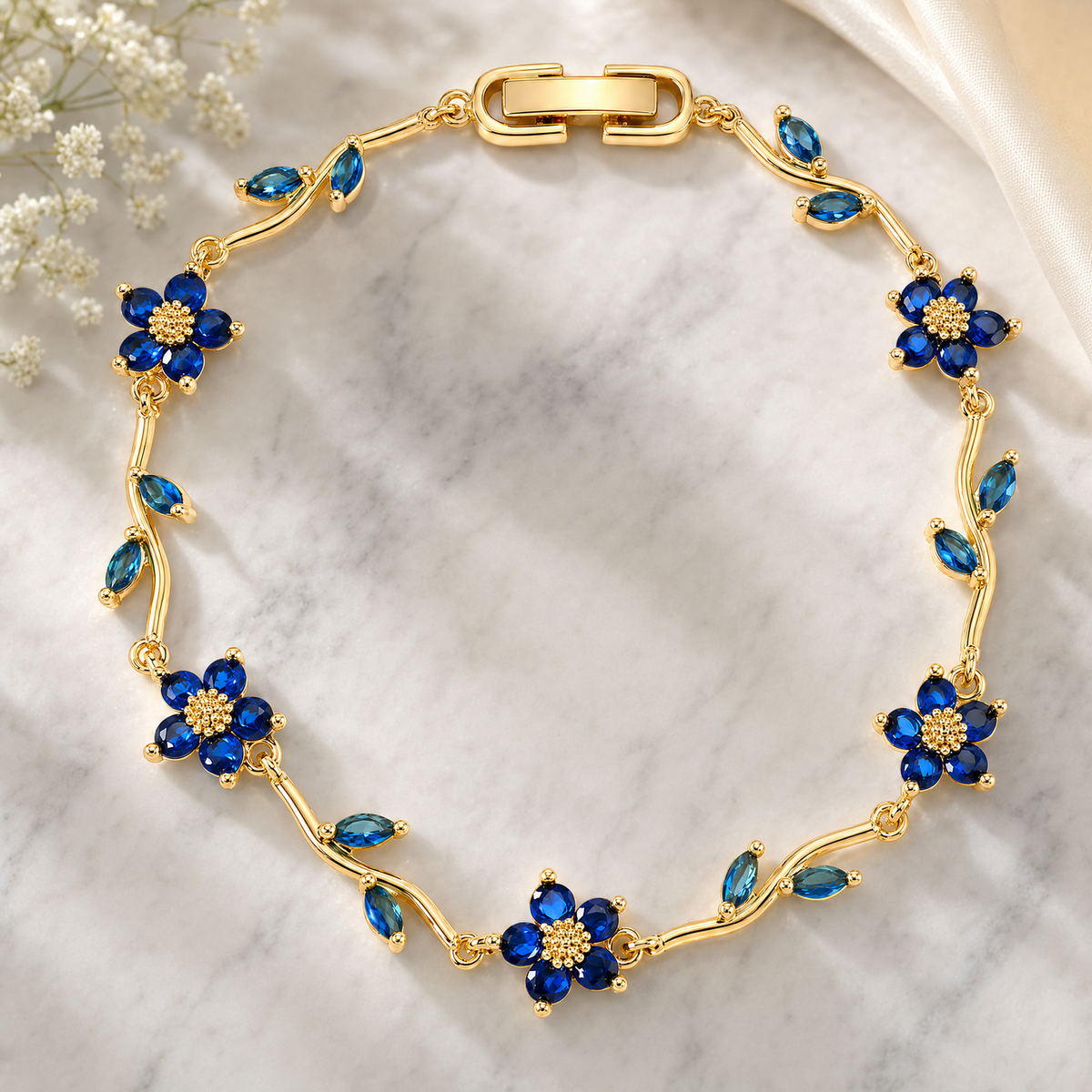 Blue Crystal Floral Vine Bracelet, Gold Plated Brass Marquise Leaf Detail